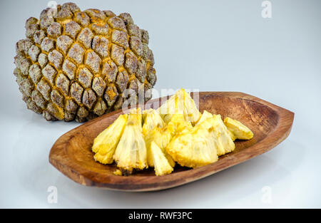 Edible part of marolo,  araticum or bruto fruit  on wooden bowl . Tropical  fruit of the original inhabitants of Brazil and Paraguai. Scientific name  Stock Photo