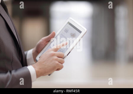 close up.businessman working on a digital tablet with financial Stock Photo
