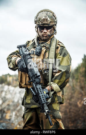 Norwegian rapid reaction special forces FSK soldier patrolling in the forest. Stock Photo