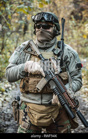 U.S. Marine Corps Marsoc raider with weapon and tactical radio