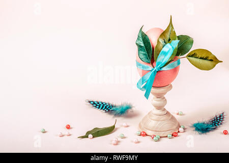 Easter greeting card with decorated egg on stand. Stock Photo