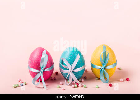 Three decorated eggs are in a row. Easter concept. Stock Photo