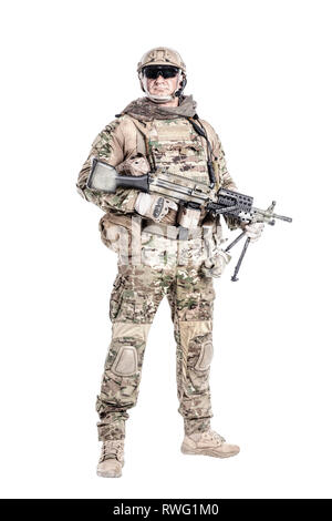 Full length portrait of muscular soldier in field uniform with machine gun Stock Photo