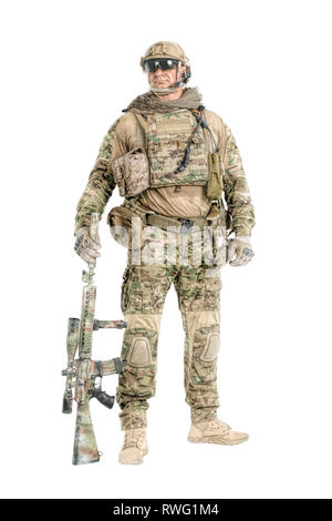 Full length portrait of muscular soldier in field uniform with sniper rifle. Stock Photo