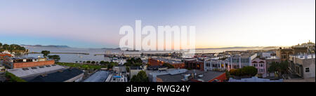 Panoramic image featuring North Point neighborhood, Alcatraz, Fishermans Wharf and San Francisco bay at daybreak Stock Photo
