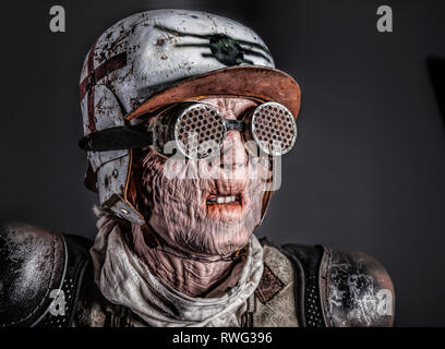 Post apocalyptic survivor with ugly face. Skin burned by atomic flame. Stock Photo