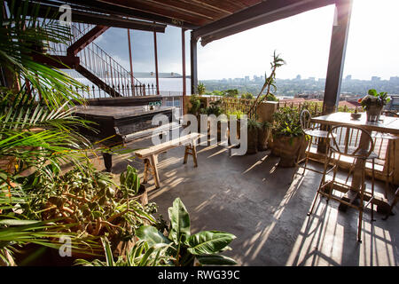 Johannesburg, South Africa, 18th January - 2019: Terrace view with a piano and tables in entertainment venue. Stock Photo
