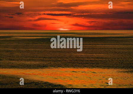 The sun sinks over the horizon, Lake Huron, Ontario, Canada Stock Photo