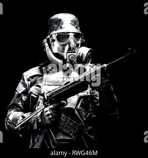 Futuristic Nazi soldier with submachine gun. Stock Photo