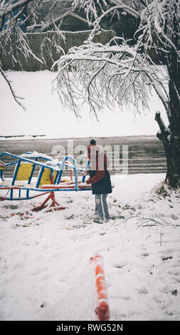 Young Boy Playing In Snow Stock Photo