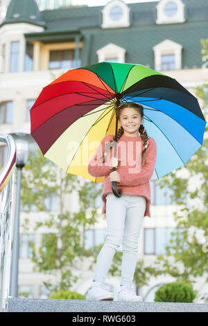 Colorful accessory positive influence. Bright umbrella. Stay positive and optimistic. Everything better with my umbrella. Colorful accessory for cheerful mood. Girl child long hair with umbrella. Stock Photo