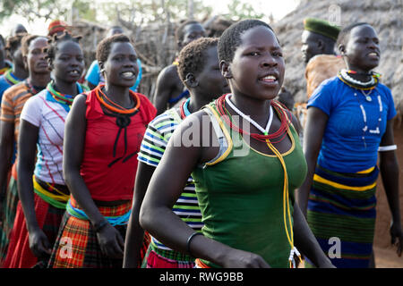 Traditional Karamojong dancing in a village, northern Uganda Stock Photo