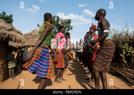 Traditional Karamojong dancing in a village, northern Uganda Stock Photo