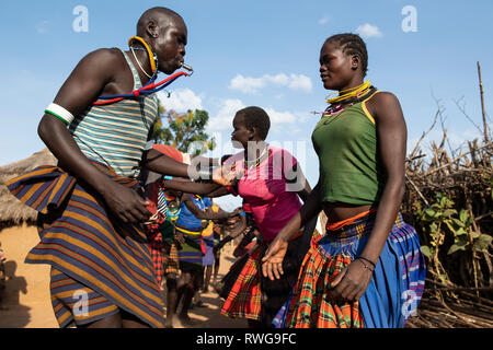 Traditional Karamojong dancing in a village, northern Uganda Stock Photo