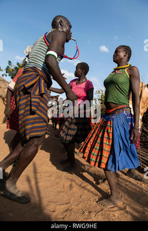 Traditional Karamojong dancing in a village, northern Uganda Stock Photo