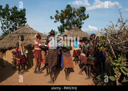 Traditional Karamojong dancing in a village, northern Uganda Stock Photo