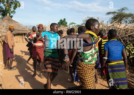 Traditional Karamojong dancing in a village, northern Uganda Stock Photo