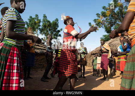 Traditional Karamojong dancing in a village, northern Uganda Stock Photo