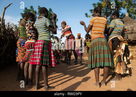 Traditional Karamojong dancing in a village, northern Uganda Stock Photo