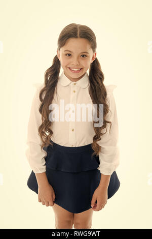 Cute and stylish. Gorgeous tails perfect for every day of week. Cute everyday back to school hairstyles. Schoolgirl happy smiling pupil long curly hair. Hairstyle for schoolgirl nice and easy. Stock Photo