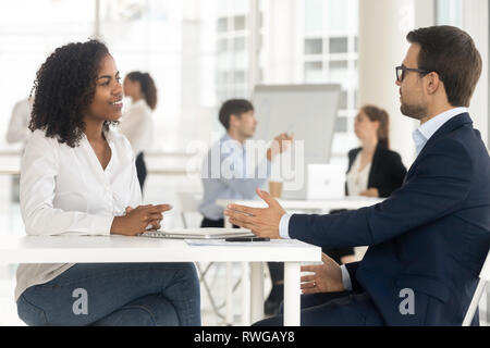 Multiracial businesspeople working together in shared office Stock Photo