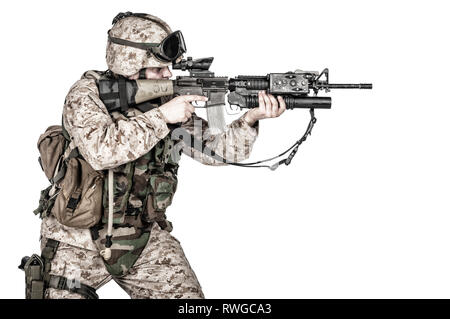 Studio shot of soldier with machine gun, isolated on white background. Stock Photo