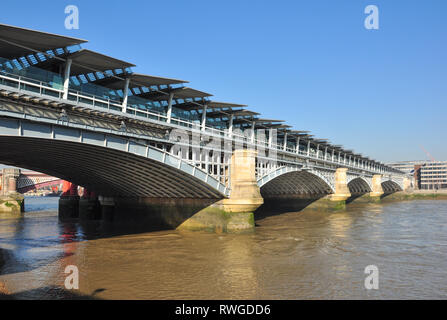 Blackfriars railway bridge and station over the River Thames, London, England, UK Stock Photo