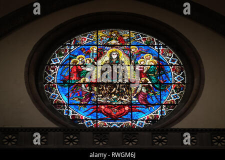 Virgin Mary surrounded by Angels by Lorenzo Ghiberti, 1405, stained glass window in the Cattedrale di Santa Maria del Fiore in Florence Stock Photo