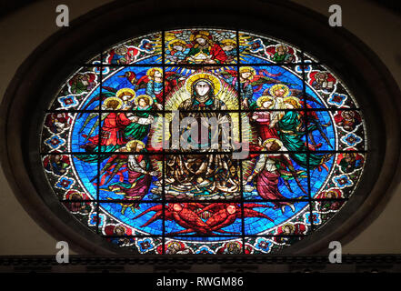 Virgin Mary surrounded by Angels by Lorenzo Ghiberti, 1405, stained glass window in the Cattedrale di Santa Maria del Fiore in Florence Stock Photo