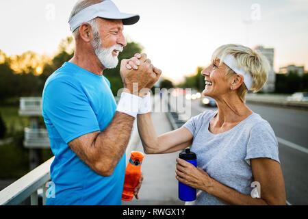 Mature couple is doing sport outdoors. Healthy lifestyle concept Stock Photo