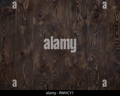 Wood background. Dark wooden texture empty surface. Copy space for text and design. Dark brown larch rustic wooden table top. vertical stripes of boards Stock Photo