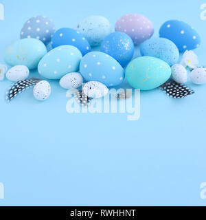 Easter eggs on blue background with empty space. Easter card Stock Photo