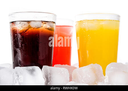 Colorful soft drinks for summer with ice cubes on white background. Stock Photo