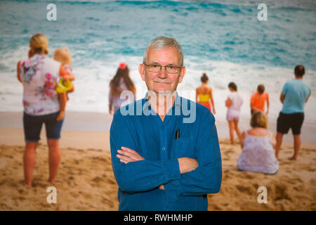 Magnum photographer Martin Parr stands with his work from Porthcurno, Cornwall. Stock Photo