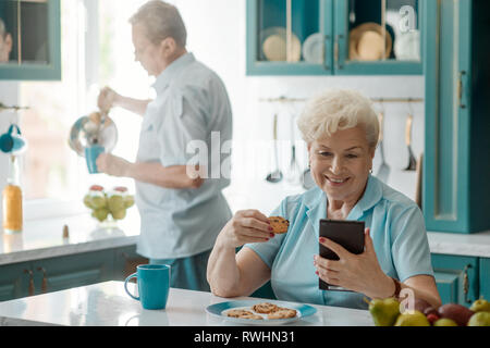 Grandma using a cell phone Stock Photo