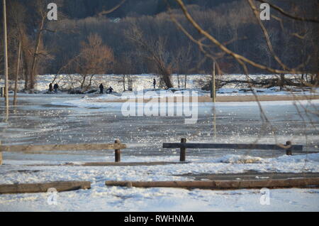 People walking on the beach in winter Stock Photo