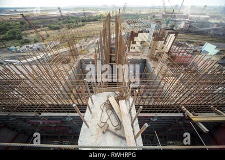 landscape, panorama, view of factory slums with metal hulls and machines for the production of the coking industry, smoking pipes and reconstruction o Stock Photo