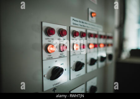 Close up shot of switches and indication lights on an electric board. Stock Photo