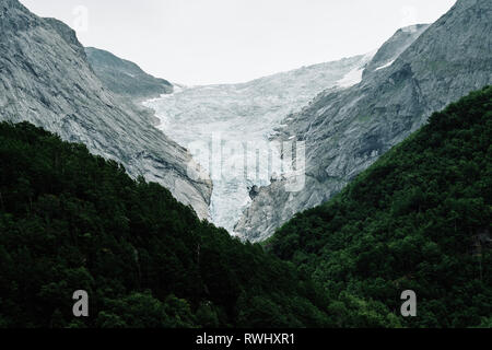 Glacier Retreat - The retreating Briksdal Glacier / Briksdalsbreen an arm of the larger Jostedalsbreen glacier in Stryn Norway. Stock Photo