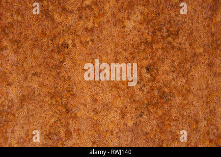 Old Distressed Brown Terracotta Copper Rusty Stone Background with Rough Texture Multicolored Inclusions. Stained Gradient Coarse Grainy Surface Stock Photo