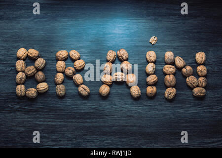 Brain letters sign made with walnuts against blue background. Brain health concept nutrition Stock Photo
