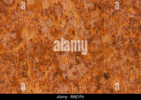 Old Distressed Brown Terracotta Copper Rusty Stone Background with Rough Texture Multicolored Inclusions. Stained Gradient Coarse Grainy Surface Stock Photo