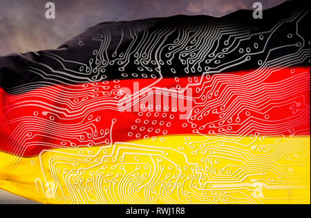 German flag with board in front of dramatic sky Stock Photo