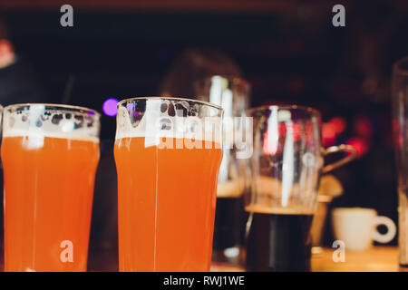 Beer glasses with beer on the bar Stock Photo