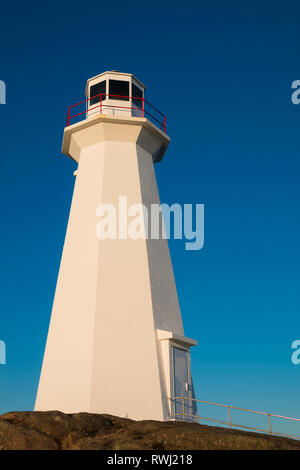 Watching Sunrise.  Cape Spear Lighthouse National Historic Site,  the easternmost point in Canada, and North America. (52°37'W) St. John's, Newfoundland and Labrador Stock Photo