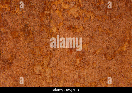 Old Distressed Brown Terracotta Copper Rusty Stone Background with Rough Texture Multicolored Inclusions. Stained Gradient Coarse Grainy Surface Stock Photo