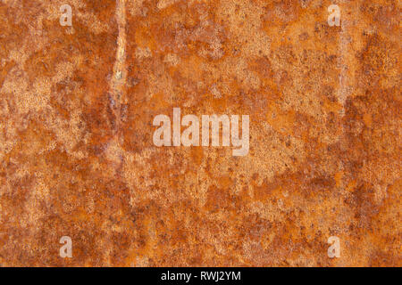 Old Distressed Brown Terracotta Copper Rusty Stone Background with Rough Texture Multicolored Inclusions. Stained Gradient Coarse Grainy Surface Stock Photo