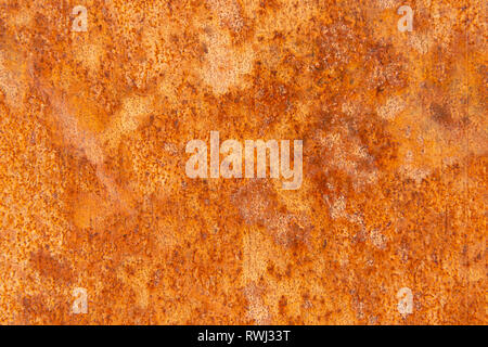 Old Distressed Brown Terracotta Copper Rusty Stone Background with Rough Texture Multicolored Inclusions. Stained Gradient Coarse Grainy Surface Stock Photo