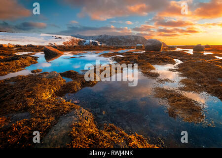 Sun setting over the gulf of St Lawerence, Rocky Harbour, Gros Morne National Park, Newfoundland and Labrador Stock Photo