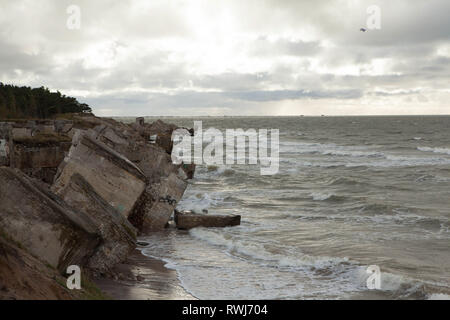 Abandoned coastline fortifications falling into baltic sea from the former Soviet military base, Liepaja, Karosta, Latvia Stock Photo